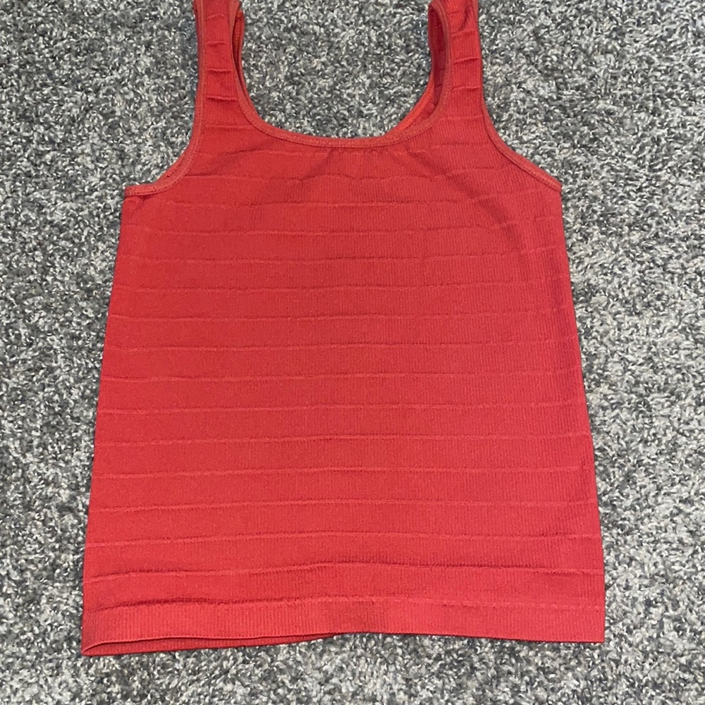 Burnt orange tank top.